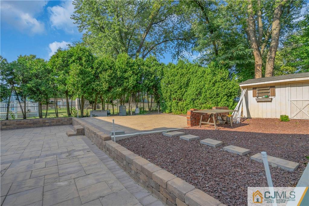16 Channing Road East Brunswick, NJ 08816 - Photo 35 of 36 a view of backyard with a barn and large trees
