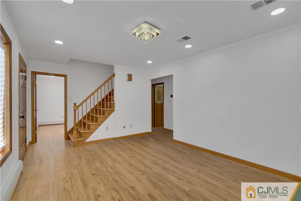 16 Channing Road East Brunswick, NJ 08816 - Photo 5 of 36 a view of an entryway with wooden floor