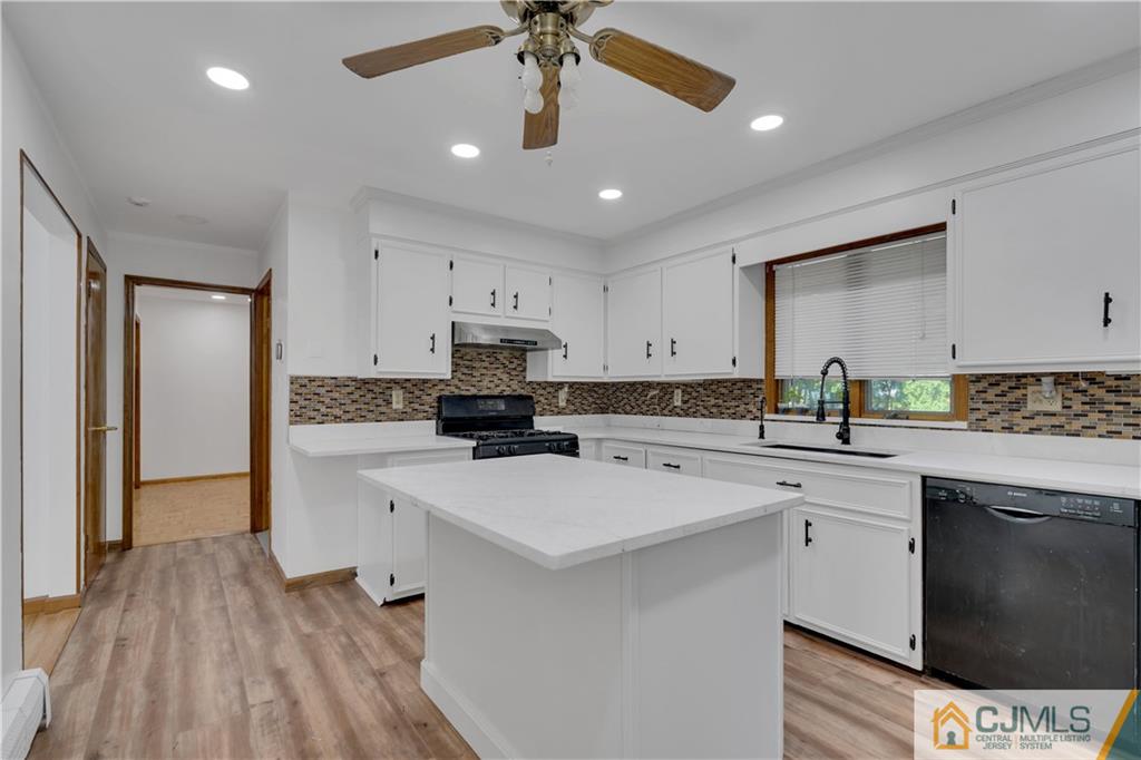 16 Channing Road East Brunswick, NJ 08816 - Photo 10 of 36 a kitchen with a sink stainless steel appliances and white cabinets