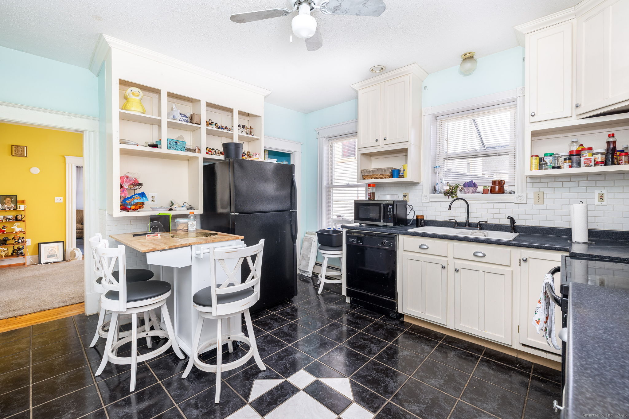 372 Pleasant Street Windham, CT 06226 - Photo 14 of 30 a kitchen with stainless steel appliances a sink a stove a refrigerator cabinets and dining table