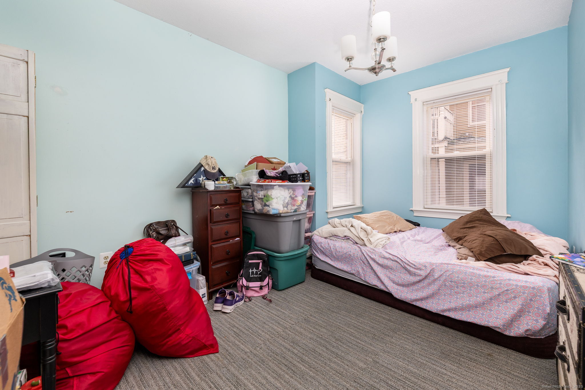 372 Pleasant Street Windham, CT 06226 - Photo 15 of 30 a bedroom with a bed and window