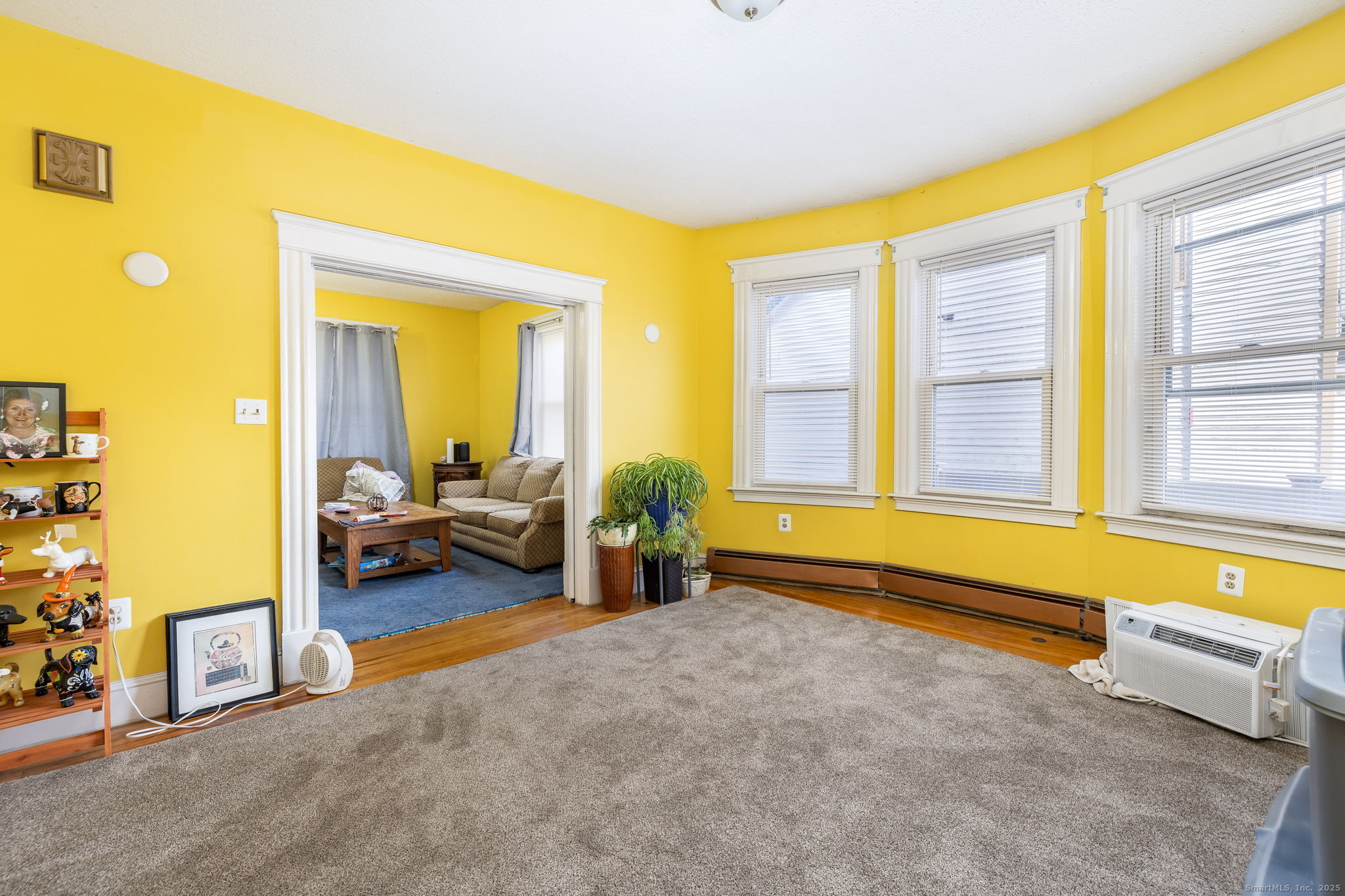 372 Pleasant Street Windham, CT 06226 - Photo 17 of 30 a spacious bedroom with a bed and a couch