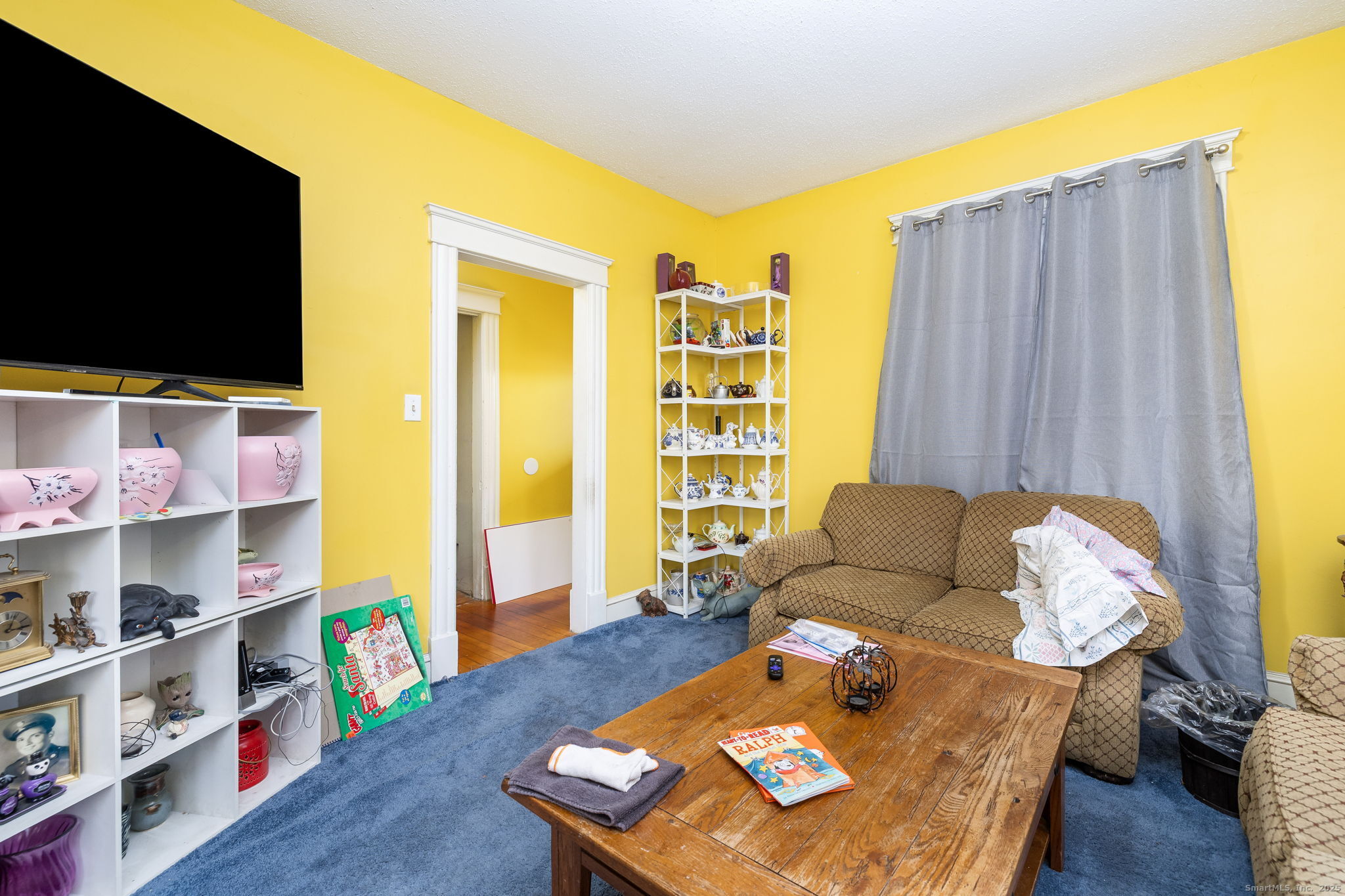 372 Pleasant Street Windham, CT 06226 - Photo 19 of 30 a living room with furniture and a flat screen tv