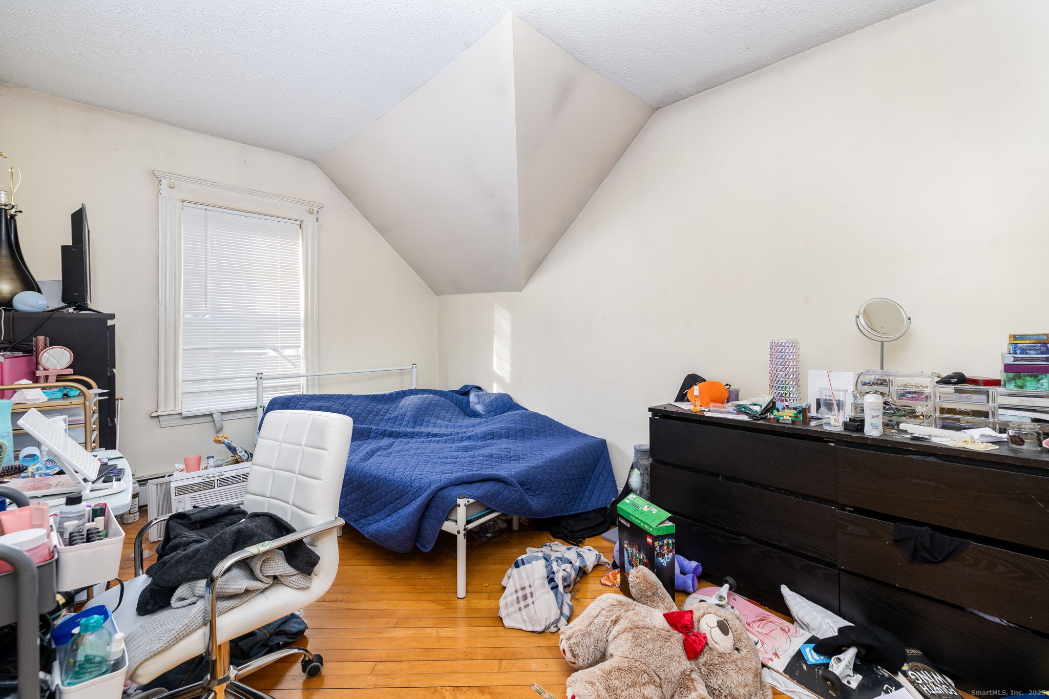 372 Pleasant Street Windham, CT 06226 - Photo 27 of 30 a living room with furniture and a wooden floor