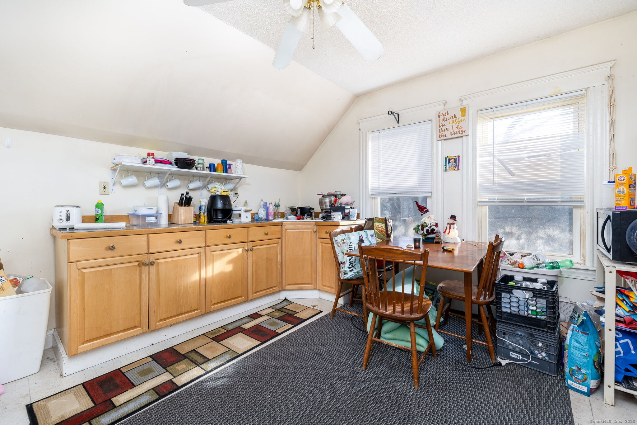 372 Pleasant Street Windham, CT 06226 - Photo 28 of 30 a dining hall with furniture a rug and a window