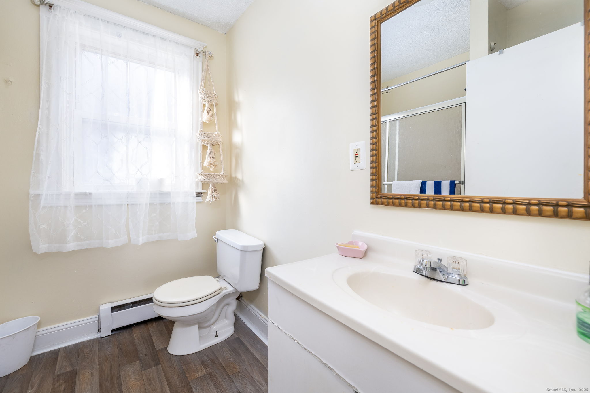 372 Pleasant Street Windham, CT 06226 - Photo 29 of 30 a white toilet sitting next to a bathroom sink