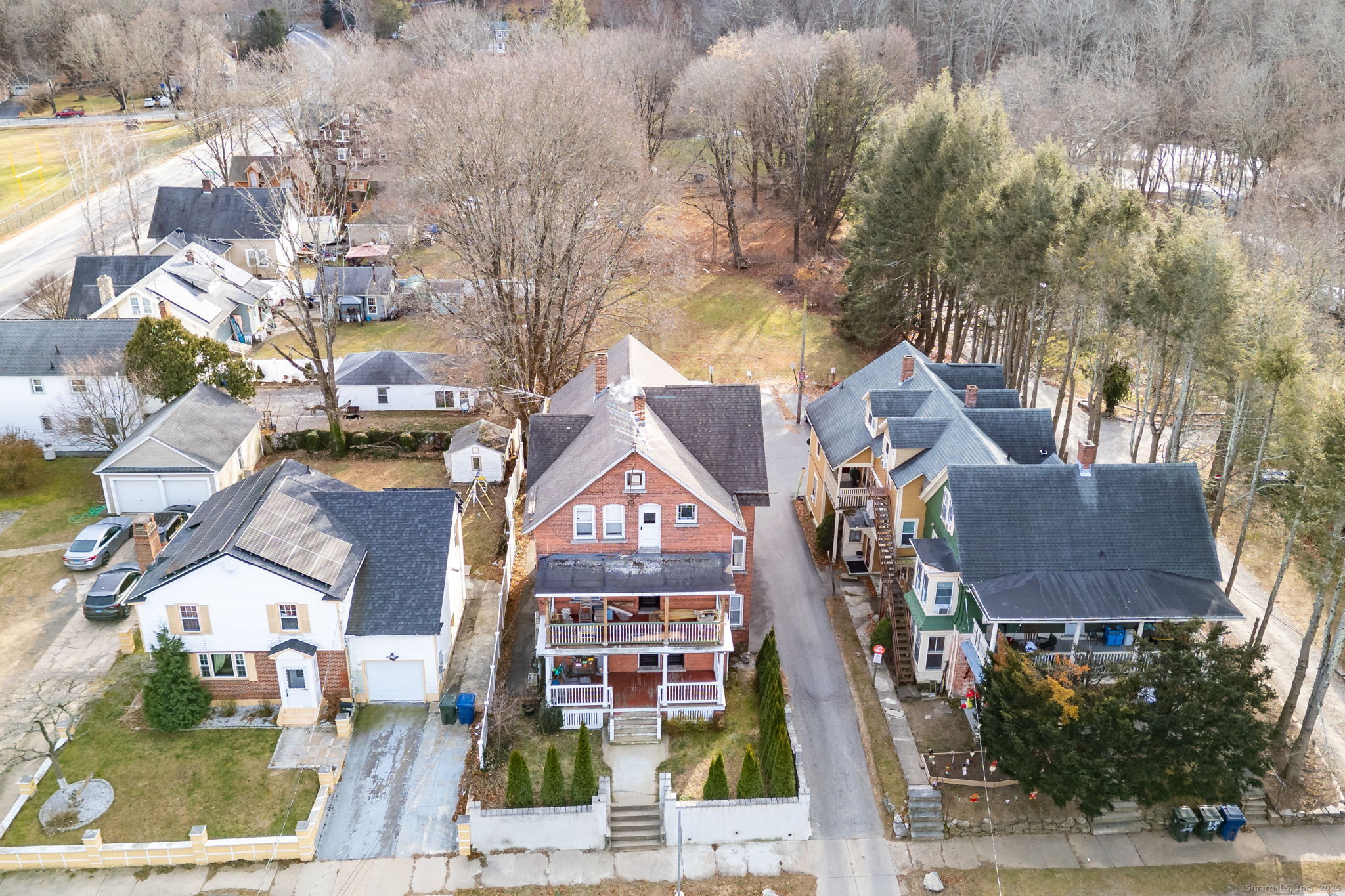 372 Pleasant Street Windham, CT 06226 - Photo 3 of 30 a aerial view of a residential apartment building with a yard