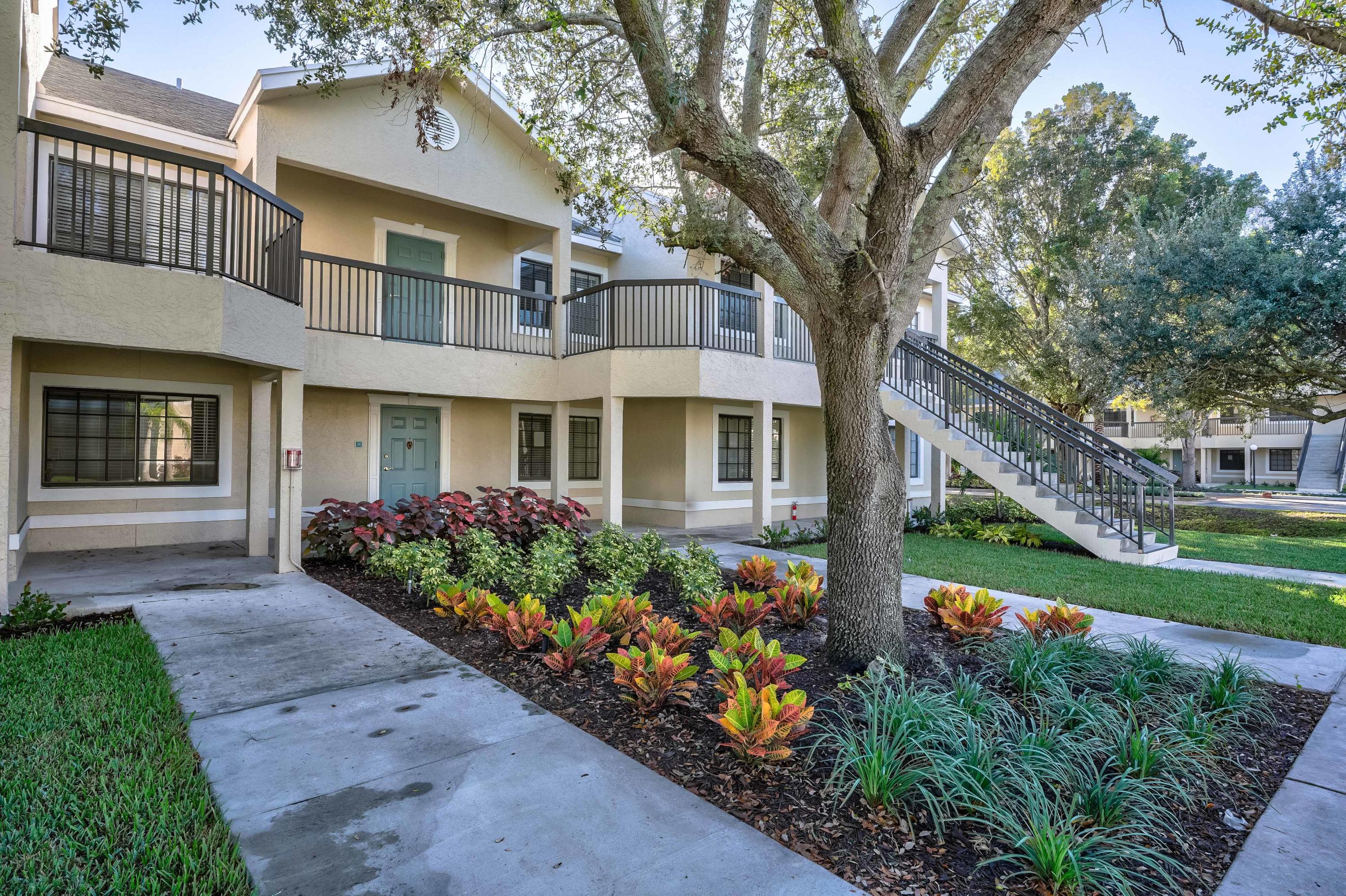 4685 Haverhill Road, Unit A8 West Palm Beach, FL 33417 - Photo 21 of 33 front view of a house with a yard