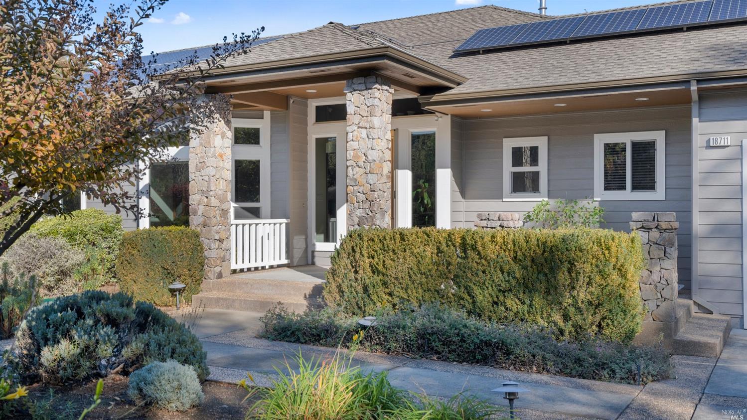 a front view of a house with garden