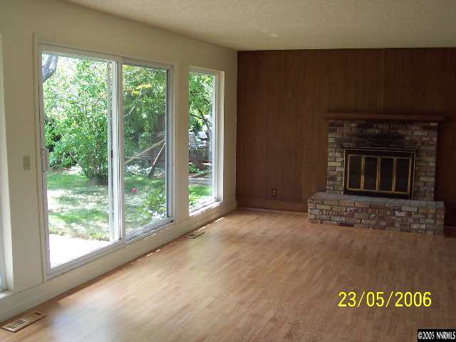 460 Tarn Way Reno, NV 89503 - Photo 2 of 4 a view of empty room with window and fireplace