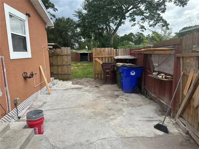 a view of backyard with outdoor seating