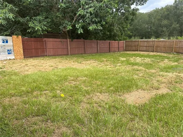 a view of a backyard with a small cabin