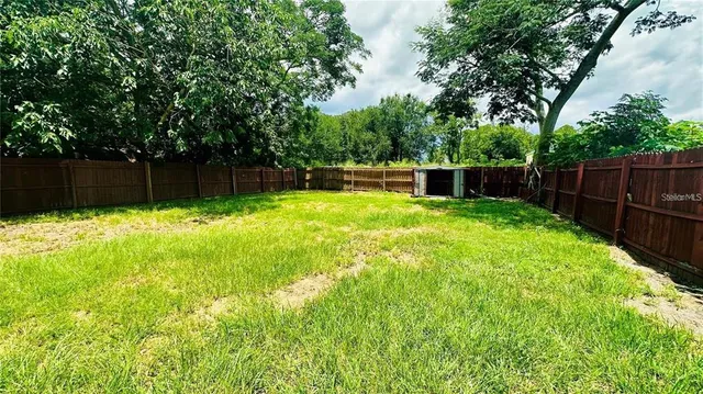 a swimming pool with wooden fence