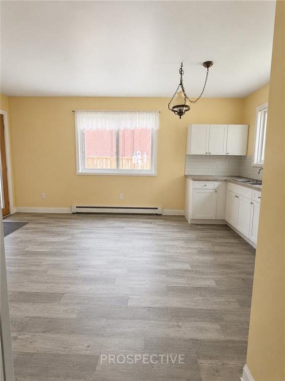 215 Maple Street Kittanning, PA 16201 - Photo 7 of 39 a view of a room with wooden floor and white walls
