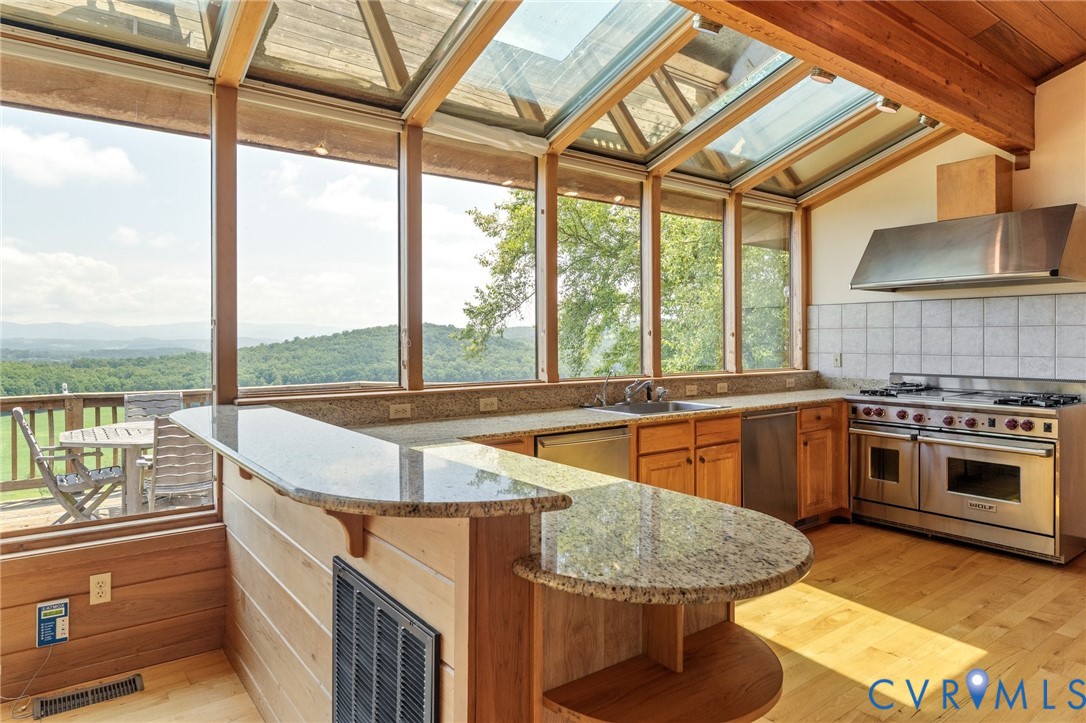 742-830 High Rock Road Middlebrook, VA 24459 - Photo 16 of 49 a kitchen with kitchen island a large window in it