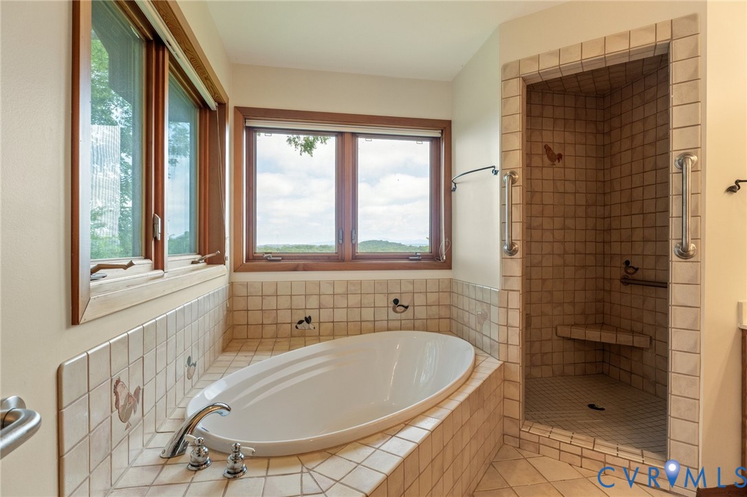 742-830 High Rock Road Middlebrook, VA 24459 - Photo 20 of 49 a bathroom with a tub a sink and a window