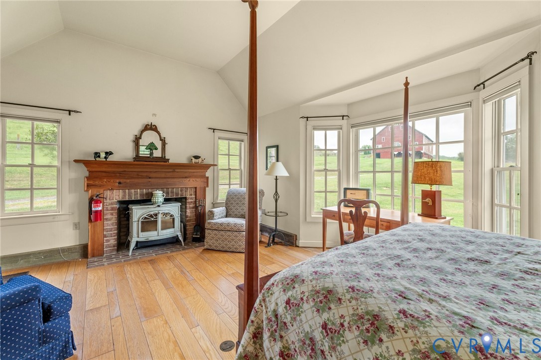742-830 High Rock Road Middlebrook, VA 24459 - Photo 41 of 49 a spacious bedroom with a bed and a fireplace