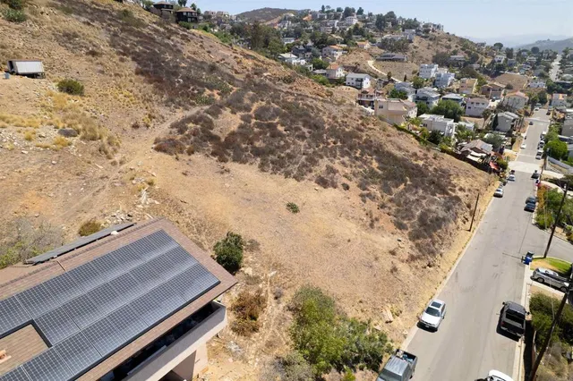 an aerial view of house with yard