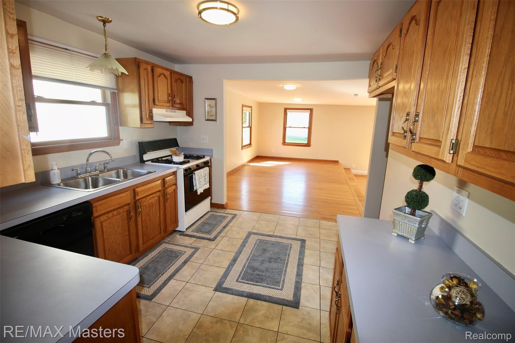 36549 Indiana Road New Boston, MI 48164 - Photo 7 of 29 The spacious dining area can be used for study, TV room or it's a great place for a giant table and family gatherings. That floor is oak hardwood.