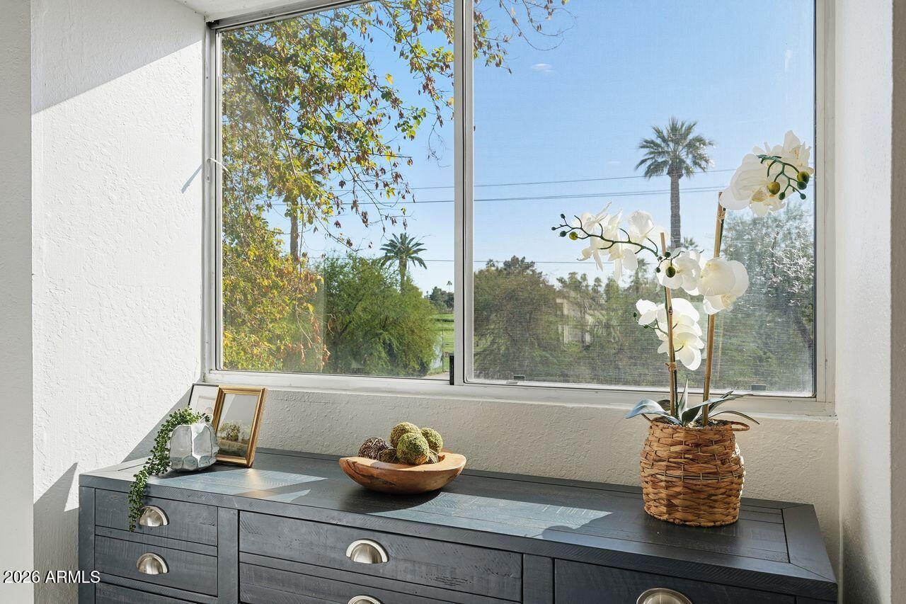 1012 East Osborn Road, Unit E Phoenix, AZ 85014 - Photo 19 of 22 a vase of flowers sitting on a table