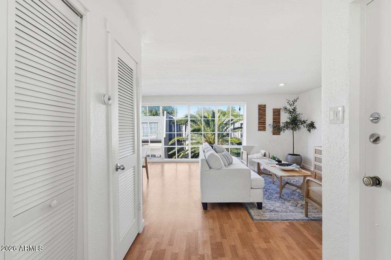 1012 East Osborn Road, Unit E Phoenix, AZ 85014 - Photo 4 of 22 a living room with furniture and a large window