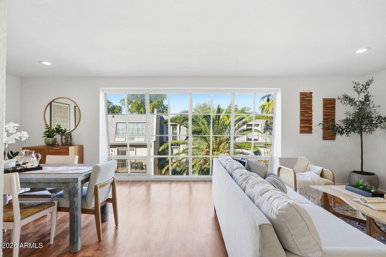 1012 East Osborn Road, Unit E Phoenix, AZ 85014 - Photo 5 of 22 a living room with furniture and a large window