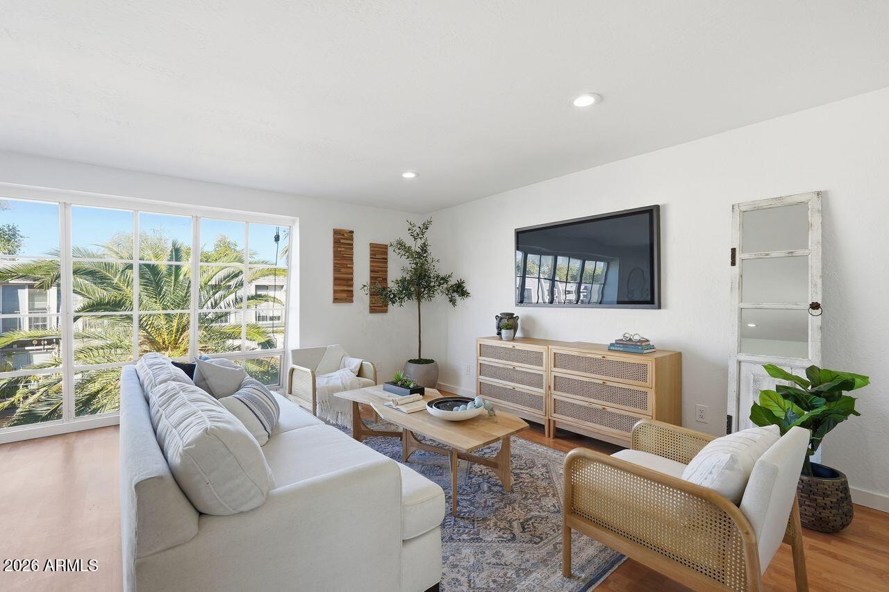 1012 East Osborn Road, Unit E Phoenix, AZ 85014 - Photo 7 of 22 a living room with furniture and large windows