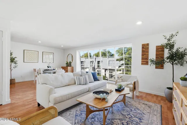 a living room with furniture and a large window