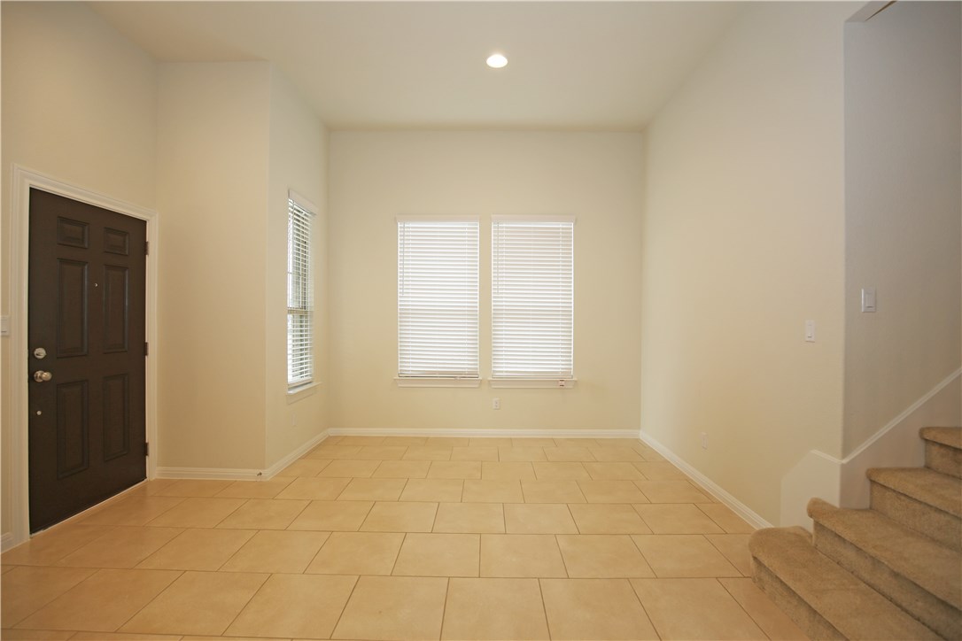 15912 Cessida Street Austin, TX 78728 - Photo 3 of 23 a view of an empty room with a window
