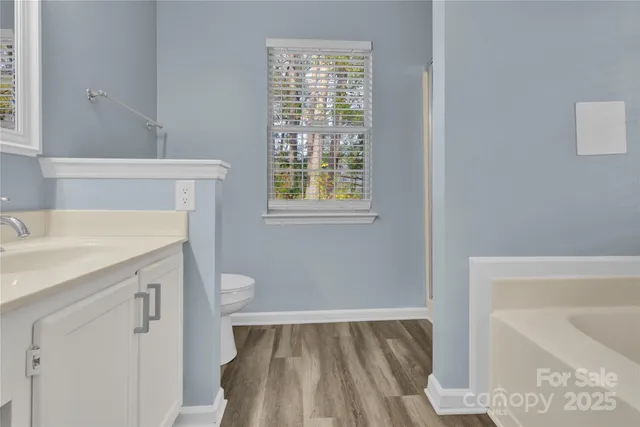 a bathroom with a bathtub and a sink