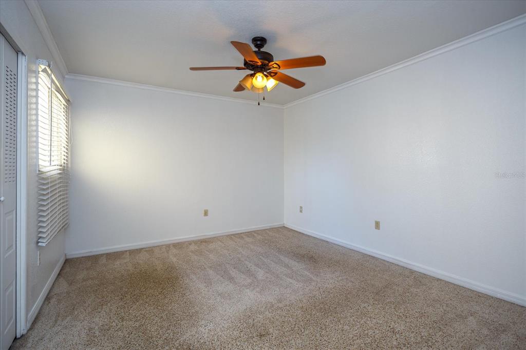908 Lake Destiny Road, Unit E Altamonte Springs, FL 32714 - Photo 12 of 20 an empty room with windows