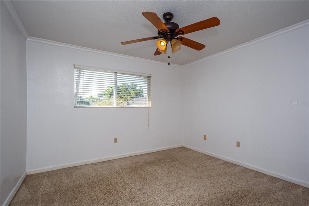 908 Lake Destiny Road, Unit E Altamonte Springs, FL 32714 - Photo 14 of 20 an empty room with a window and a fan
