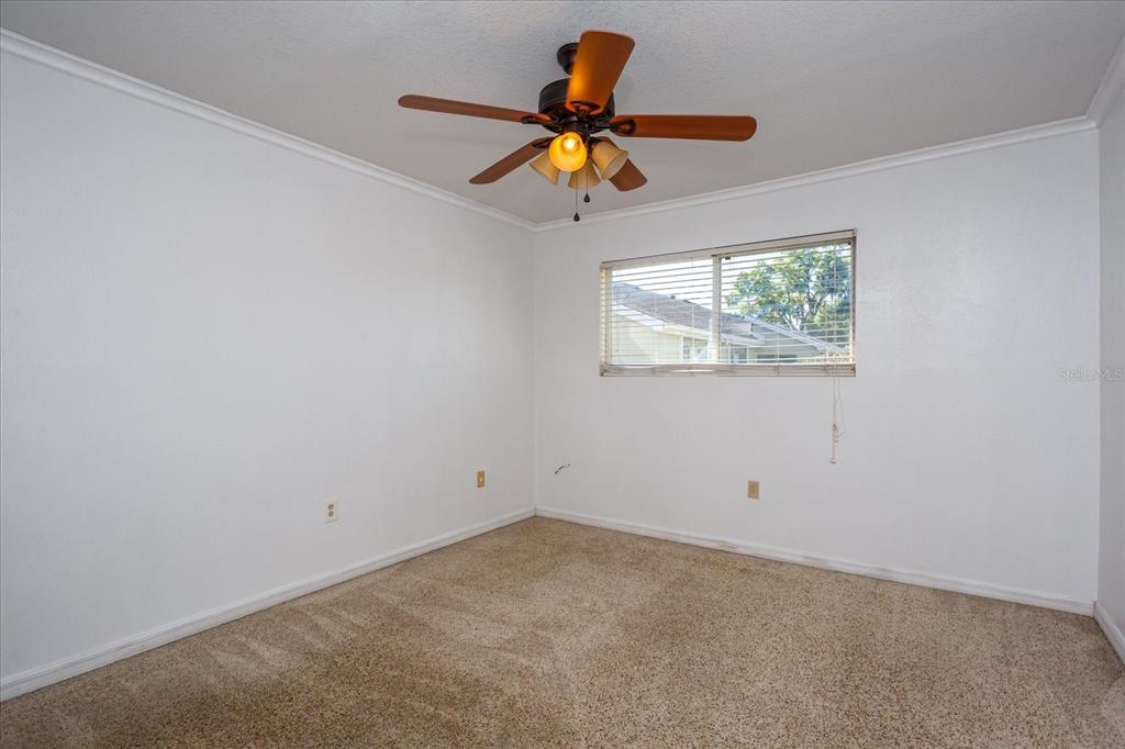 908 Lake Destiny Road, Unit E Altamonte Springs, FL 32714 - Photo 15 of 20 an empty room with wooden floor and windows