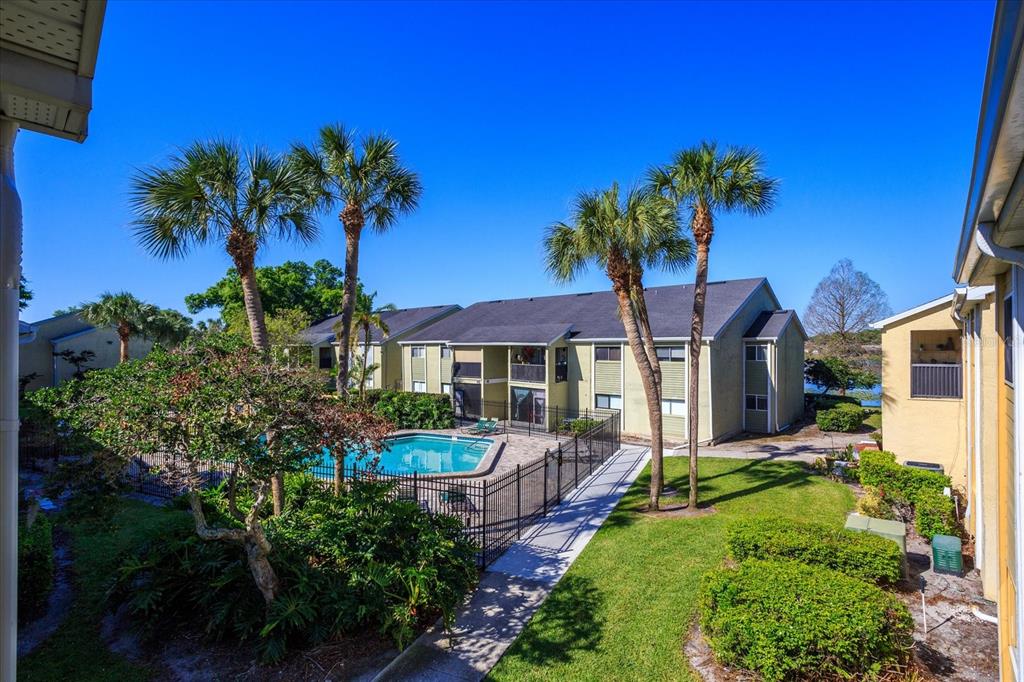 908 Lake Destiny Road, Unit E Altamonte Springs, FL 32714 - Photo 19 of 20 a front view of a house with a yard