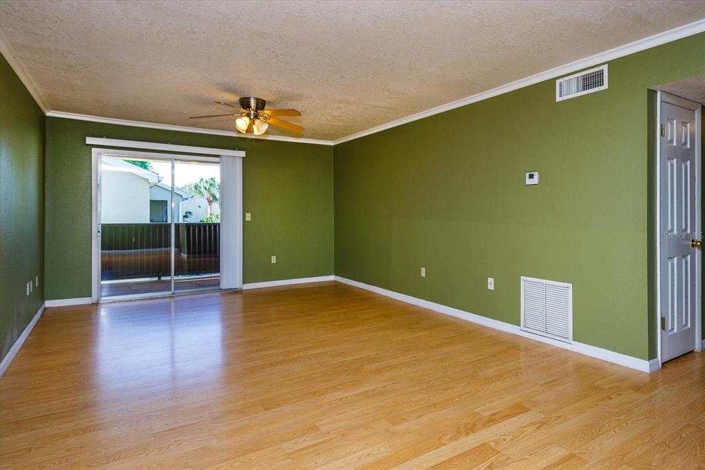 908 Lake Destiny Road, Unit E Altamonte Springs, FL 32714 - Photo 5 of 20 a view of room with window and wooden floor