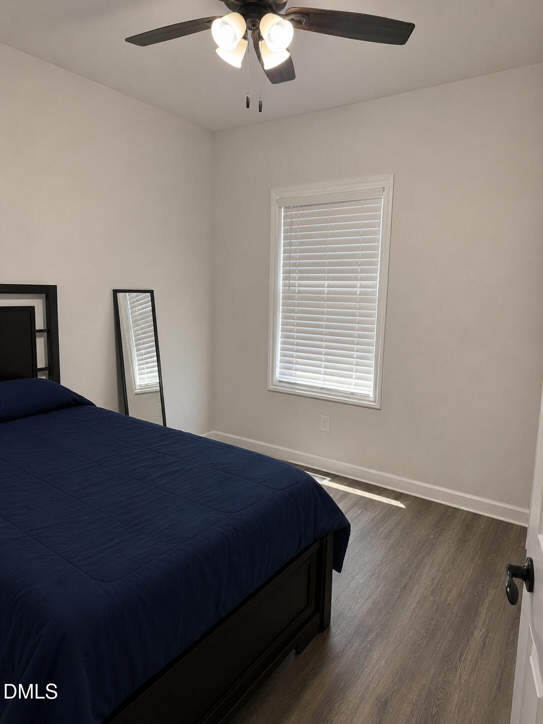 1003 Alma Street, Unit B Durham, NC 27703 - Photo 4 of 5 a bedroom with a bed and window
