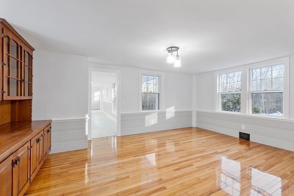 560 County Road Ashby, MA 01431 - Photo 14 of 40 a view of an empty room with wooden floor and a window