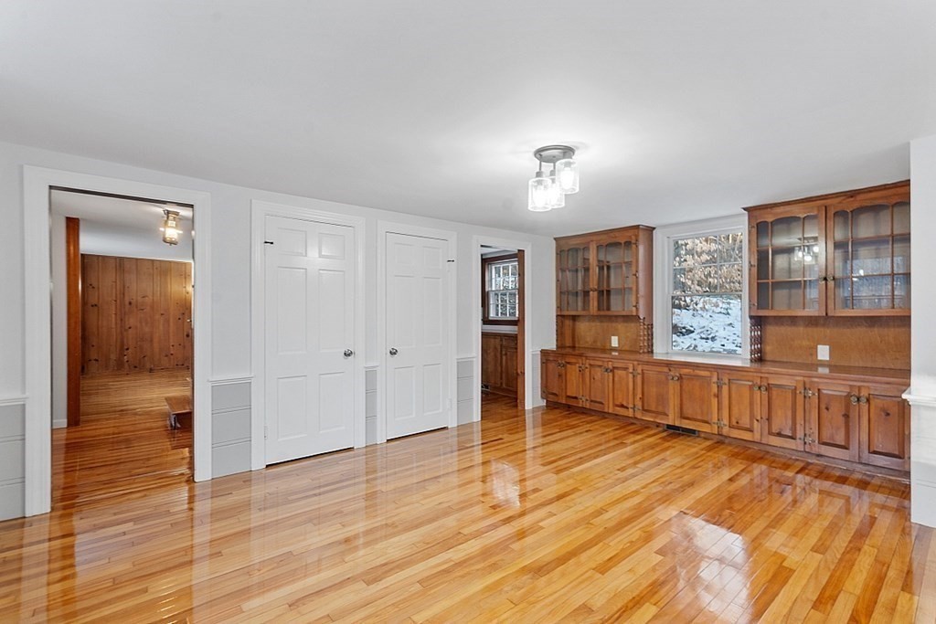 560 County Road Ashby, MA 01431 - Photo 15 of 40 a view of a hardwood floor & chandelier in a room