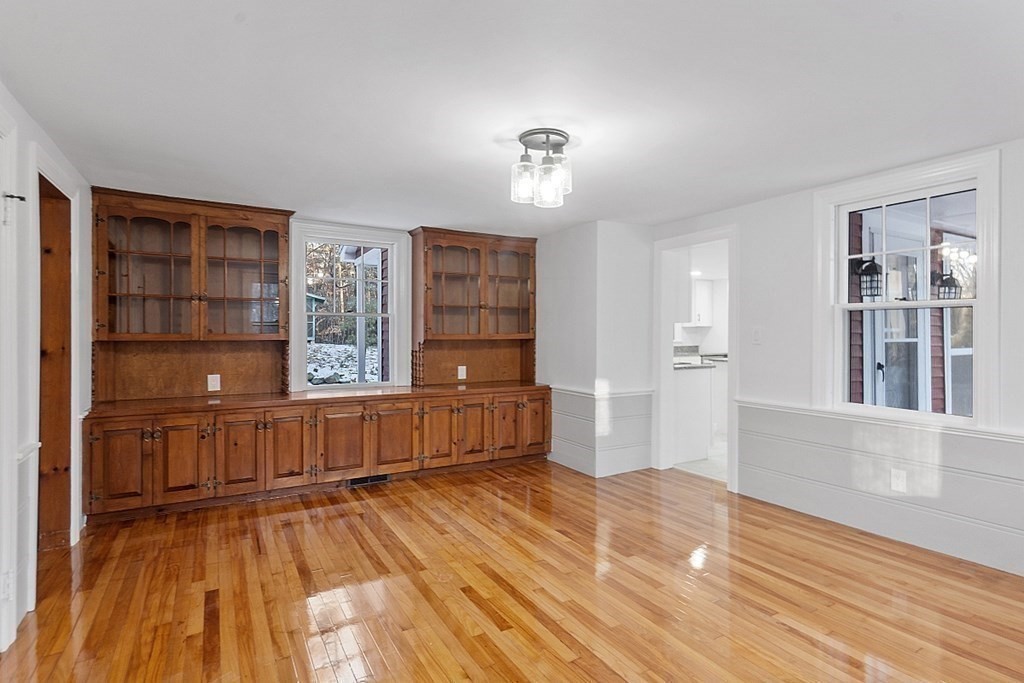 560 County Road Ashby, MA 01431 - Photo 16 of 40 wooden floor in an empty room with a window and wooden floor