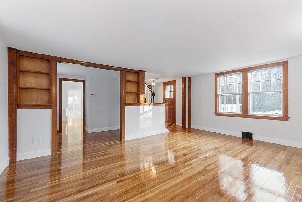 560 County Road Ashby, MA 01431 - Photo 18 of 40 a view of an empty room with wooden floor and a window