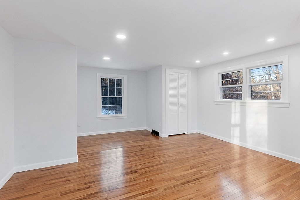 560 County Road Ashby, MA 01431 - Photo 20 of 40 a view of an empty room with wooden floor and a window
