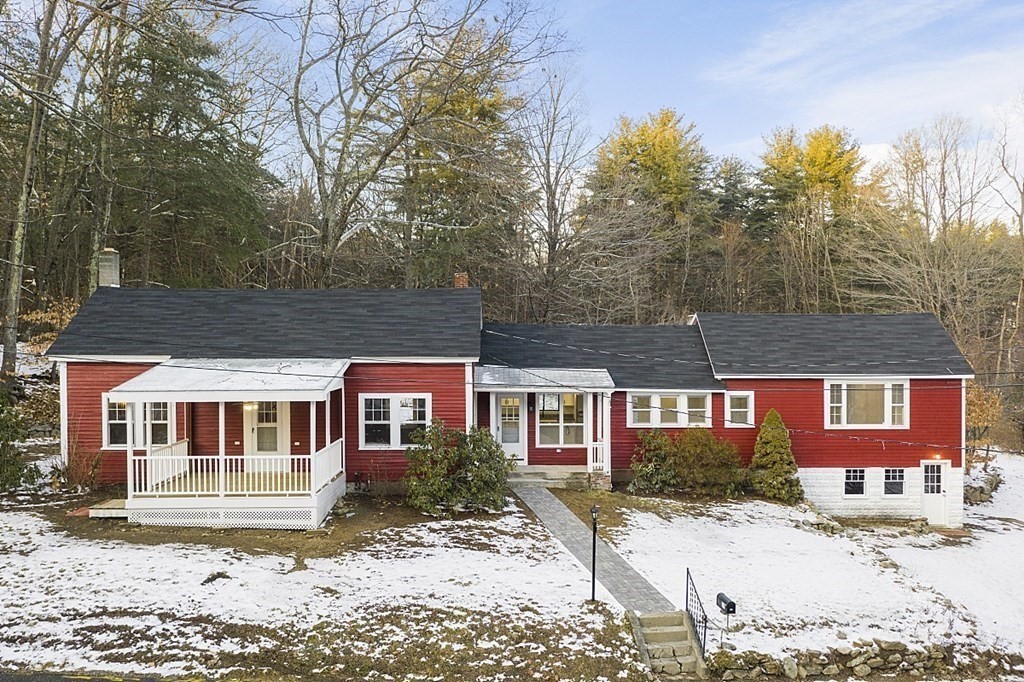 560 County Road Ashby, MA 01431 - Photo 2 of 40 a front view of a house with a yard