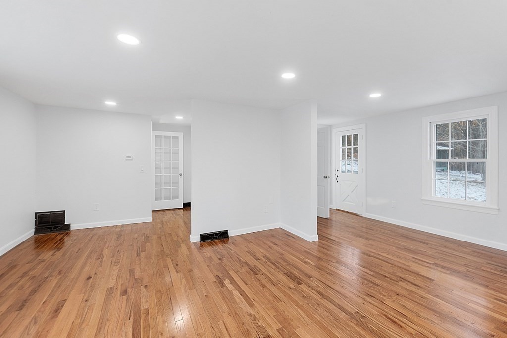 560 County Road Ashby, MA 01431 - Photo 22 of 40 a view of empty room with wooden floor and fan
