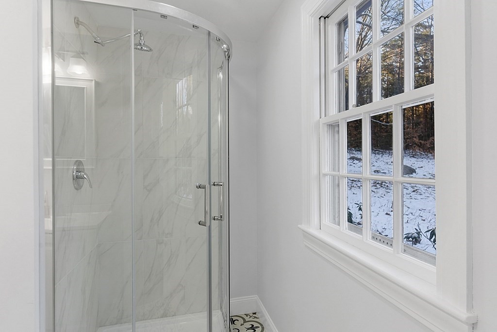 560 County Road Ashby, MA 01431 - Photo 23 of 40 a bathroom with a bathtub and shower