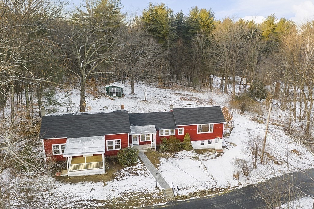 560 County Road Ashby, MA 01431 - Photo 33 of 40 a view of a house with a yard covered in snow