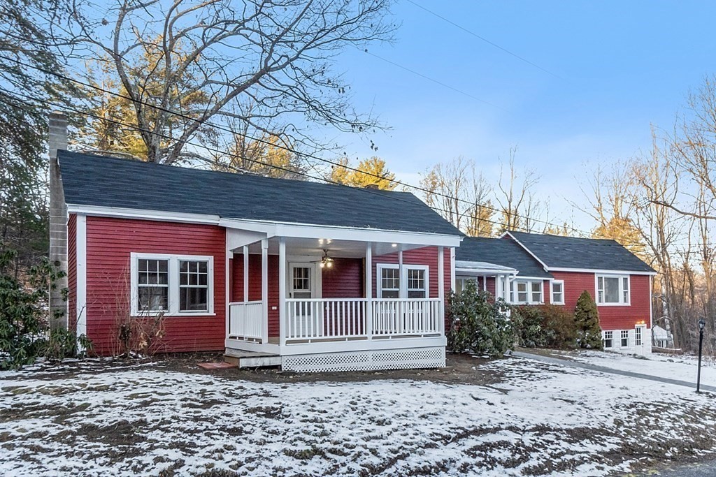 560 County Road Ashby, MA 01431 - Photo 40 of 40 a view of a brick house with large windows and a tree