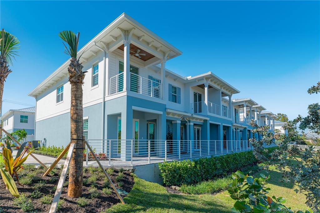 4674 Southeast Manatee Terrace Stuart, FL 34997 - Photo 12 of 55 a view of a house with backyard and plants