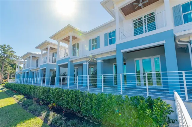 a view of swimming pool with outdoor seating and lake view