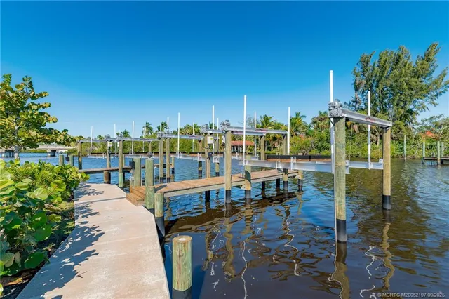a view of a lake with outdoor seating space