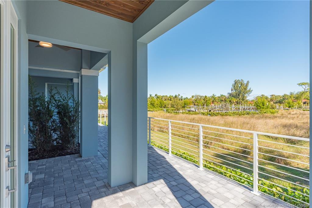 4674 Southeast Manatee Terrace Stuart, FL 34997 - Photo 25 of 55 a view of a balcony next to a yard